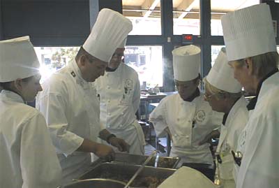 Students observing Executive Chef Kurt Waefler before practicing their skills at SDCI.